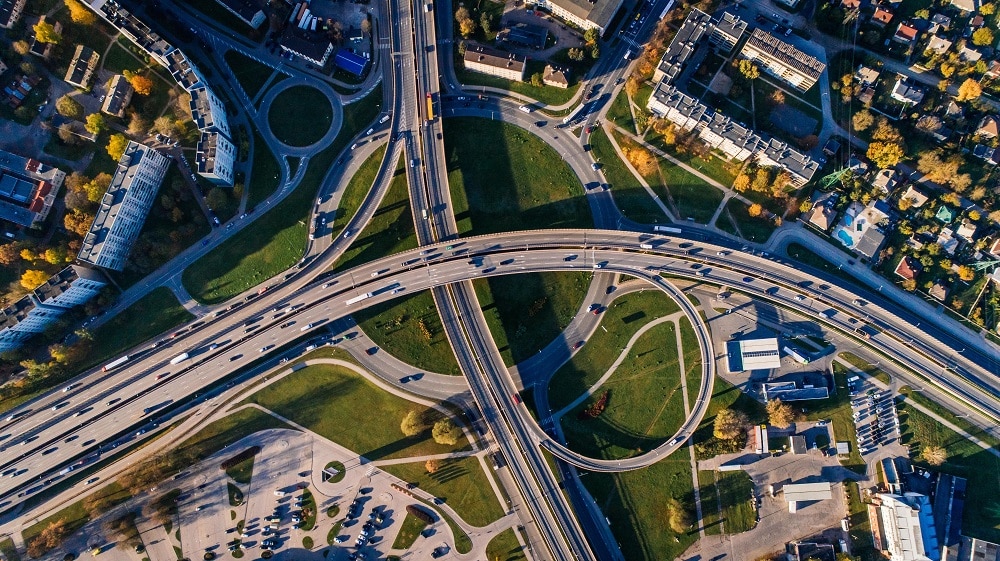 An aerial view of a complex urban environment: traffic and interconnecting roads