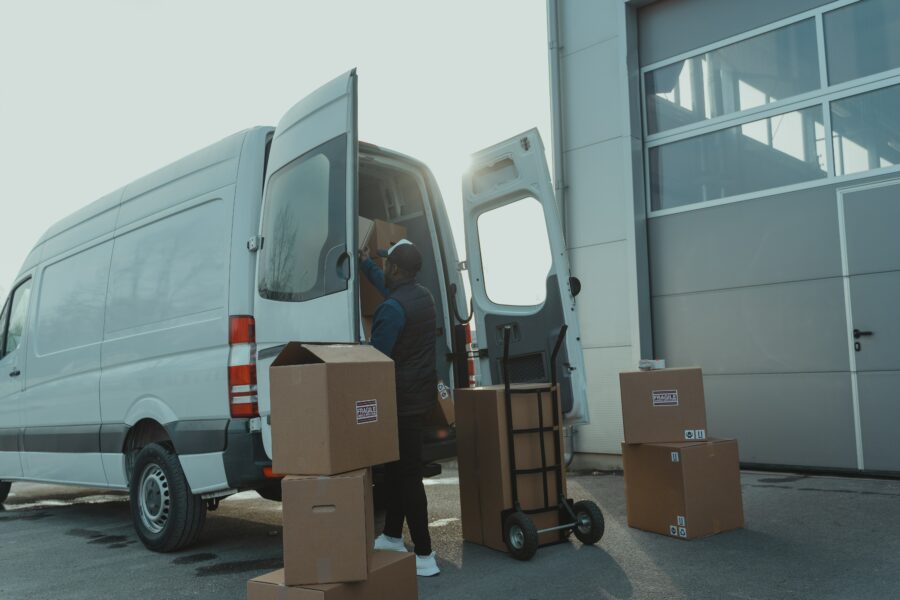 A man unloading a delivery van